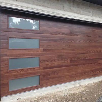 Porte sectionnelle de garage pour entrepôt avec isolation de 50mm-80mm d'épaisseur et finition thermolaquée